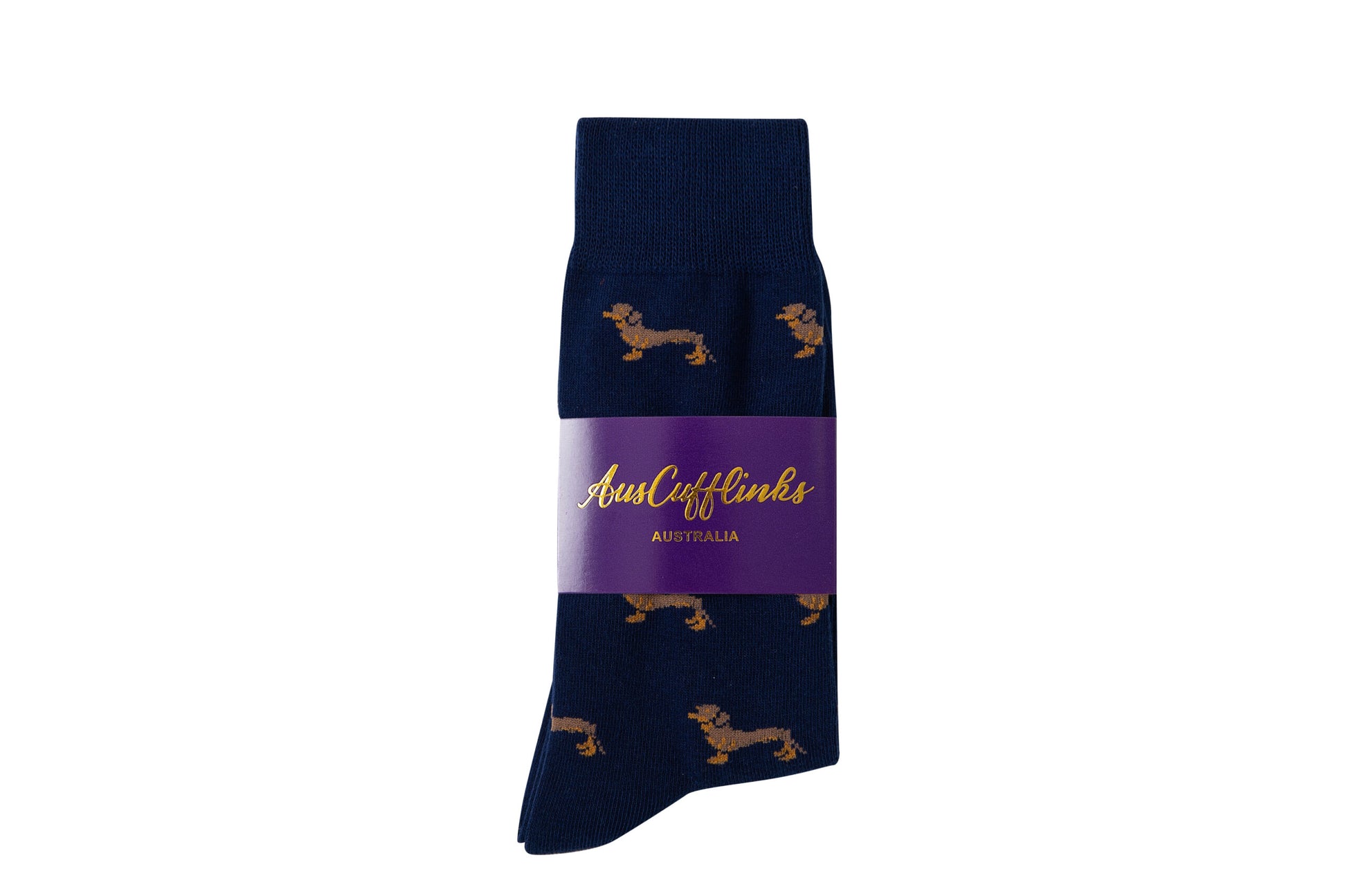 A pair of Sausage Dog Socks in navy blue, adorned with a quirky repeated dachshund pattern, wrapped in a purple band labeled "AusCufflinks Australia.