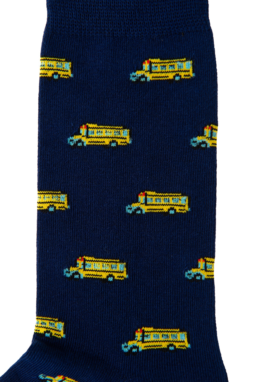 A close-up view of School Bus Socks, showcasing a dark blue hue adorned with a pattern of yellow school buses, evokes nostalgia with each step.