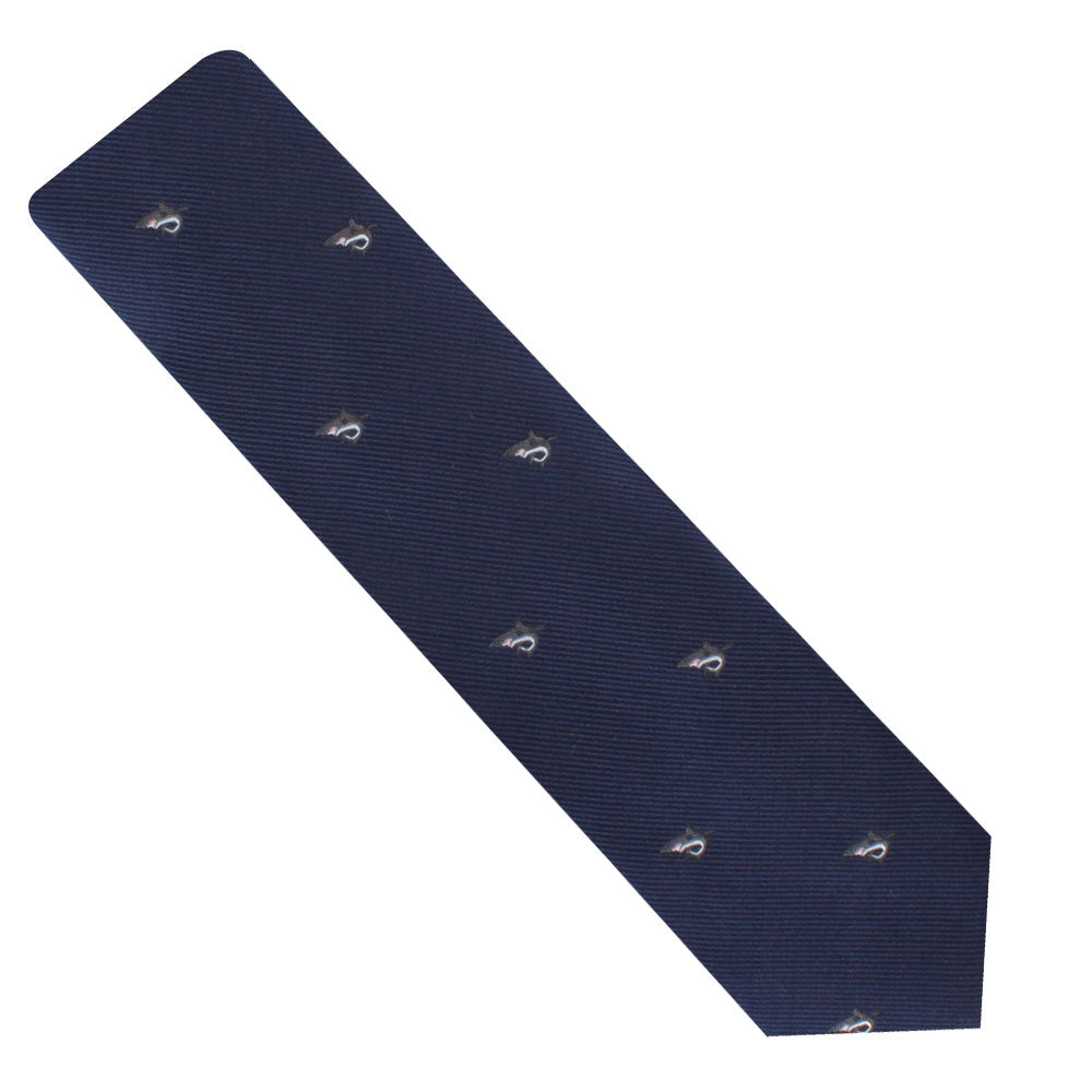 The Great White Shark Skinny Tie is an elegant navy blue necktie that features a subtle white shark motif, embroidered evenly with small patterns across its surface.