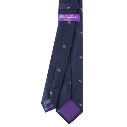 The Great White Shark Skinny Tie, in navy blue with a subtle white shark motif pattern and purple lining, featuring a label marked "AusCufflinks Australia," adds an element of intrigue to its elegance.