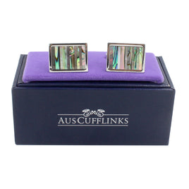 Rectangular Shell Stone Cufflinks with vibrant abalone inlay come elegantly presented in a purple velvet-lined black box featuring the "AUSCUFFLINKS" logo.