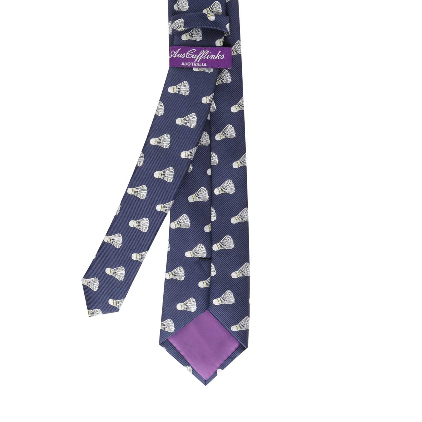 A Shuttlecock Print Tie, featuring a navy blue background with a pattern of white badminton shuttlecocks, designed to serve a sharp look, and including a purple inner lining and label.