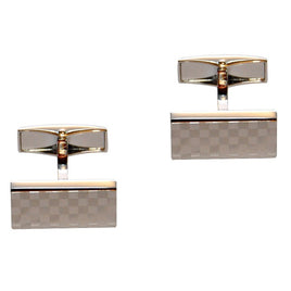 The Silver Checkered Cufflinks, featuring gold accents and set against a white background, offer a sophisticated touch to any formal outfit.