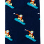 The Snowboarder Socks feature a dark blue fabric adorned with a repeating pattern of a person in an orange outfit snowboarding on a light blue board, embodying a cool alpine style.