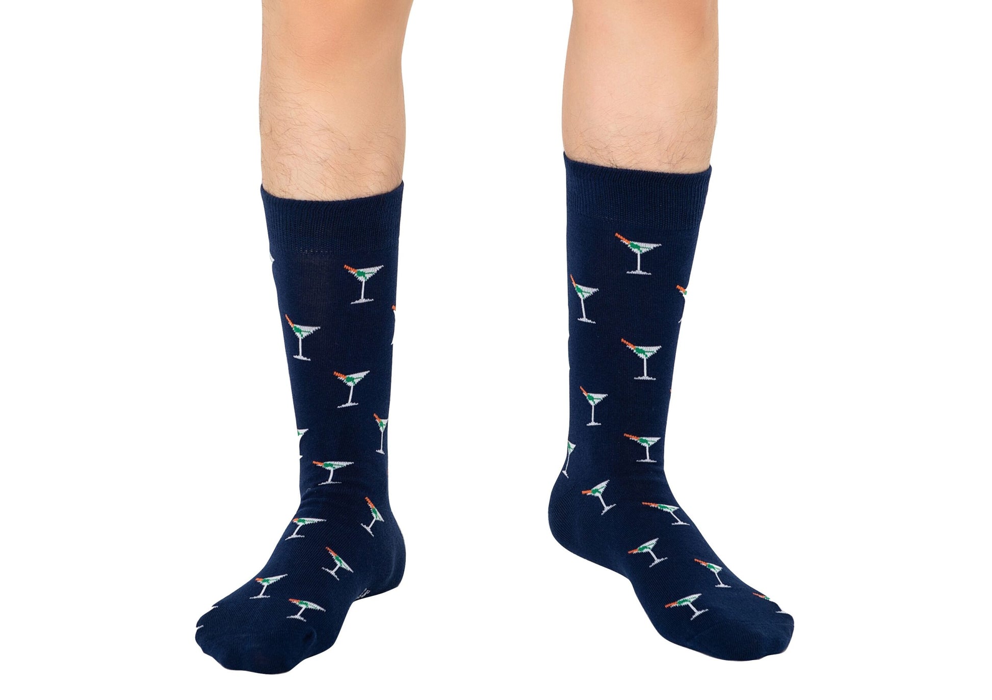 Person elevating their sock game with a playful pair of Martini Margarita Socks in navy, adorned with martini glass patterns.