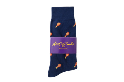 Strawberry Cake Socks: Blue socks featuring an orange chicken drumstick pattern, styled in layers and wrapped with a purple band labeled "Aust Cufflinks Australia.