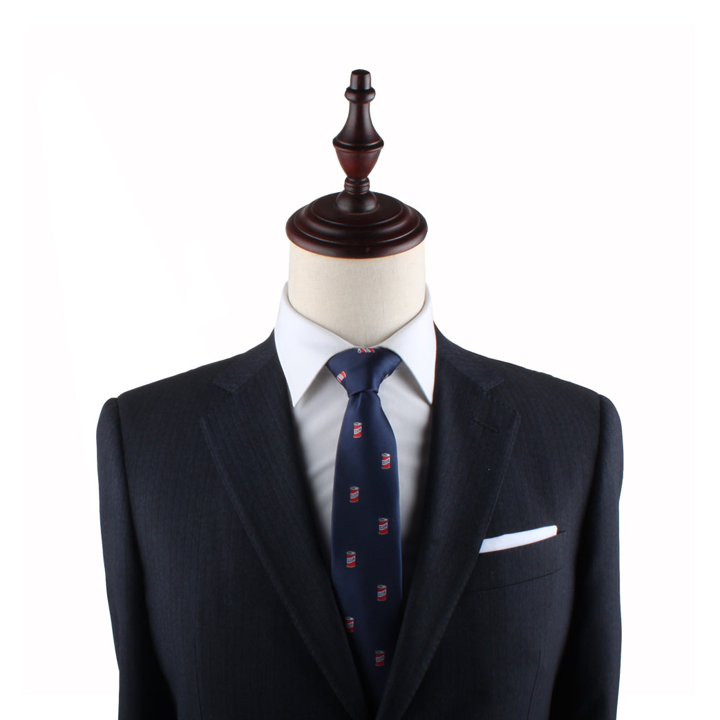 A tailor's mannequin dressed in a dark suit, white shirt, and the Soda Slim Tie exudes a refreshing style with its chic wooden headpiece.