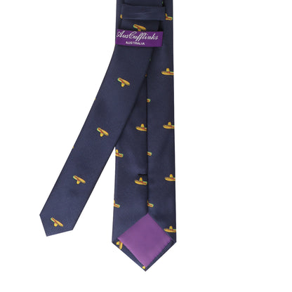 Introducing the Sombrero Thin Tie: a navy blue accessory with a stylish design showcasing a playful yellow sombrero pattern and a purple inner lining. The label, "JustCufflinks Australia," adds a touch of authenticity, making it the perfect choice for infusing fiesta vibes into any outfit.