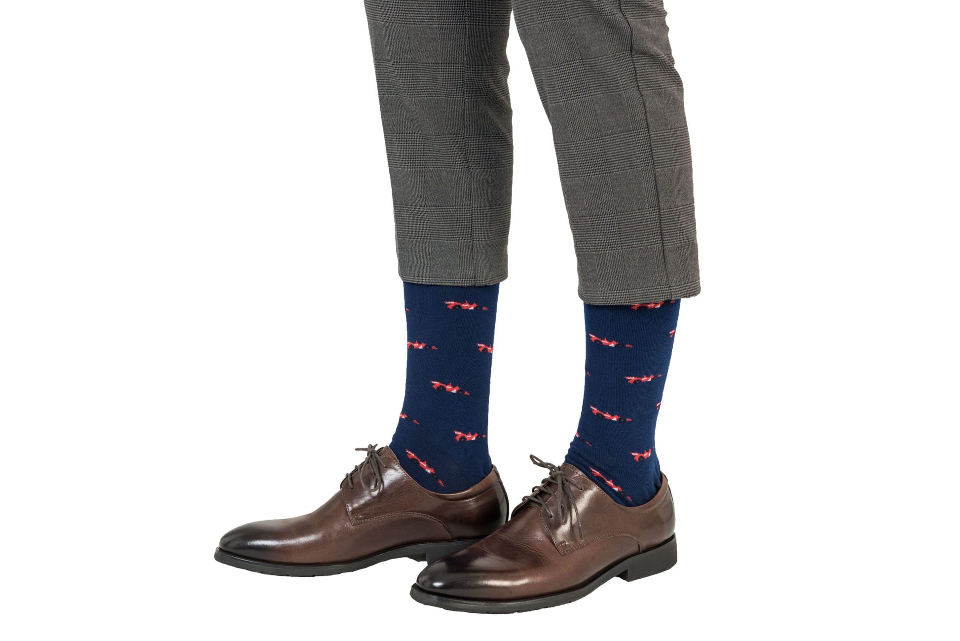 A man showcasing his impressive sock game by wearing a pair of Racing Car Socks.