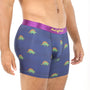 A man in Stegosaurus Underwear with a purple waistband stands against a white background, highlighting the dino-sized snugness of his stylish garment.