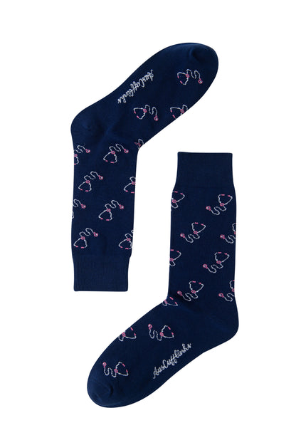 Navy blue Stethoscope Socks with a pink flamingo pattern and white cursive text on the soles—add fun to your medical wardrobe!.