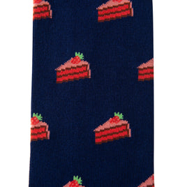 Strawberry Cake Socks: navy blue socks with a repeating pattern of red and pink layered cake slices topped with green garnish—a fun dessert-themed gift for any sweets lover.