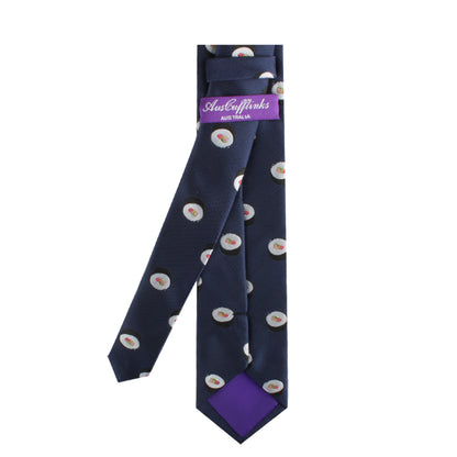 A navy-blue Sushi Chef Tie with a pattern of small fried eggs, showcasing modern charm, featuring purple brand tags marked "AusCufflinks Australia" on the back.