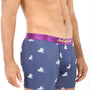 A person wearing Swimming Underwear featuring a blue patterned design and a plush purple waistband, with tattooed arm and chest partially visible, poised to dive into style.