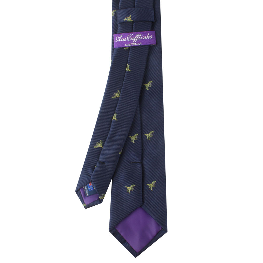 A navy blue tie with a playful pattern of small yellow kangaroos, featuring a purple label with the text “Austen Marks Australia” and a purple lining inside the bottom fold, making it perfect for dinosaur enthusiasts looking to add some charm to their wardrobe. The T-Rex Dinosaur Skinny Tie is sure to make a statement.