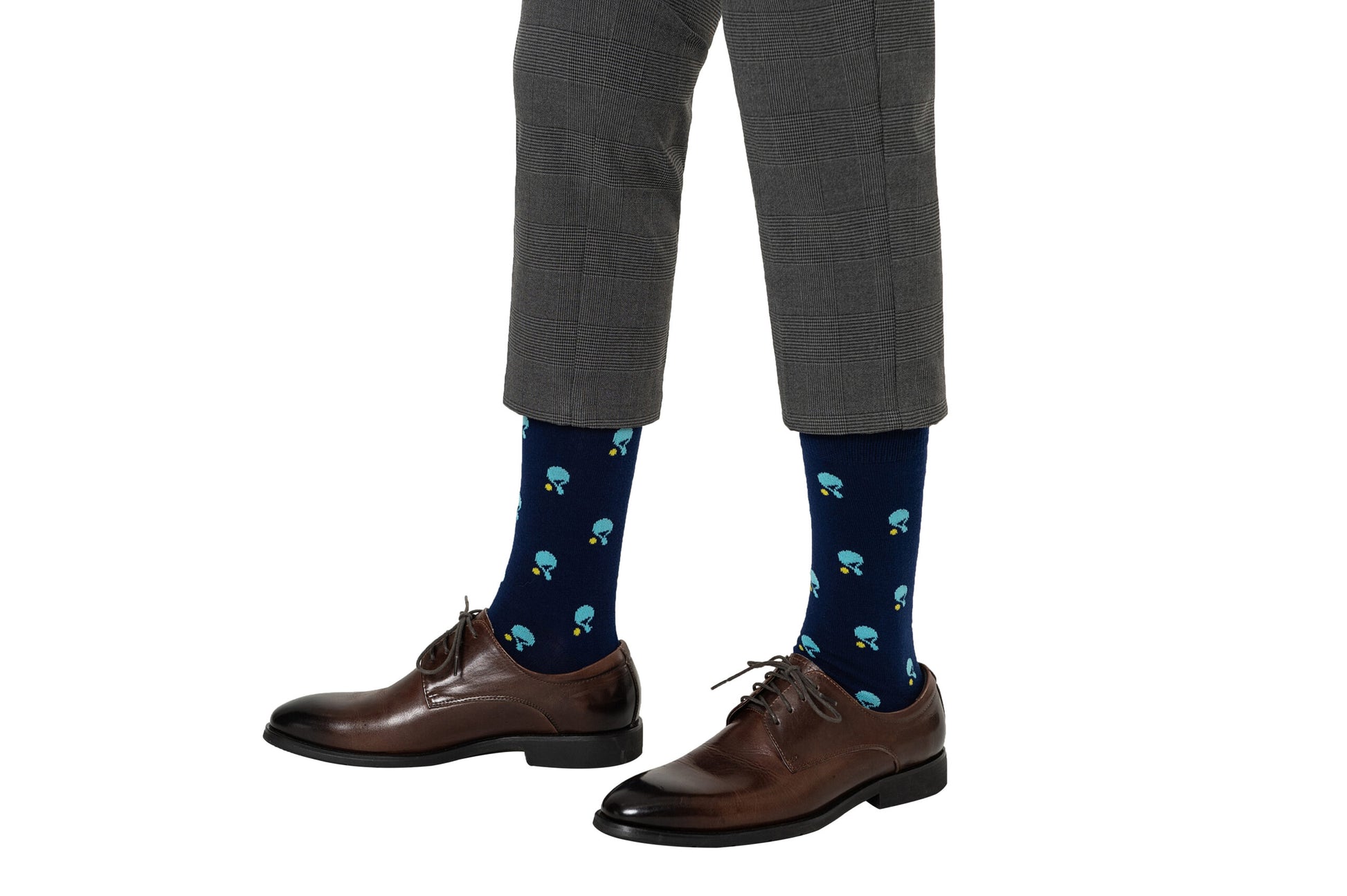 Man wearing gray pants, brown dress shoes, and dark blue Table Tennis Socks with a colorful mushroom pattern—exuding a certain sense of perfection.