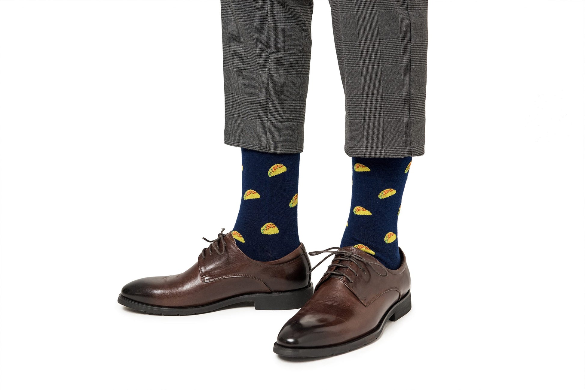 Man wearing Taco Socks and brown dress shoes.