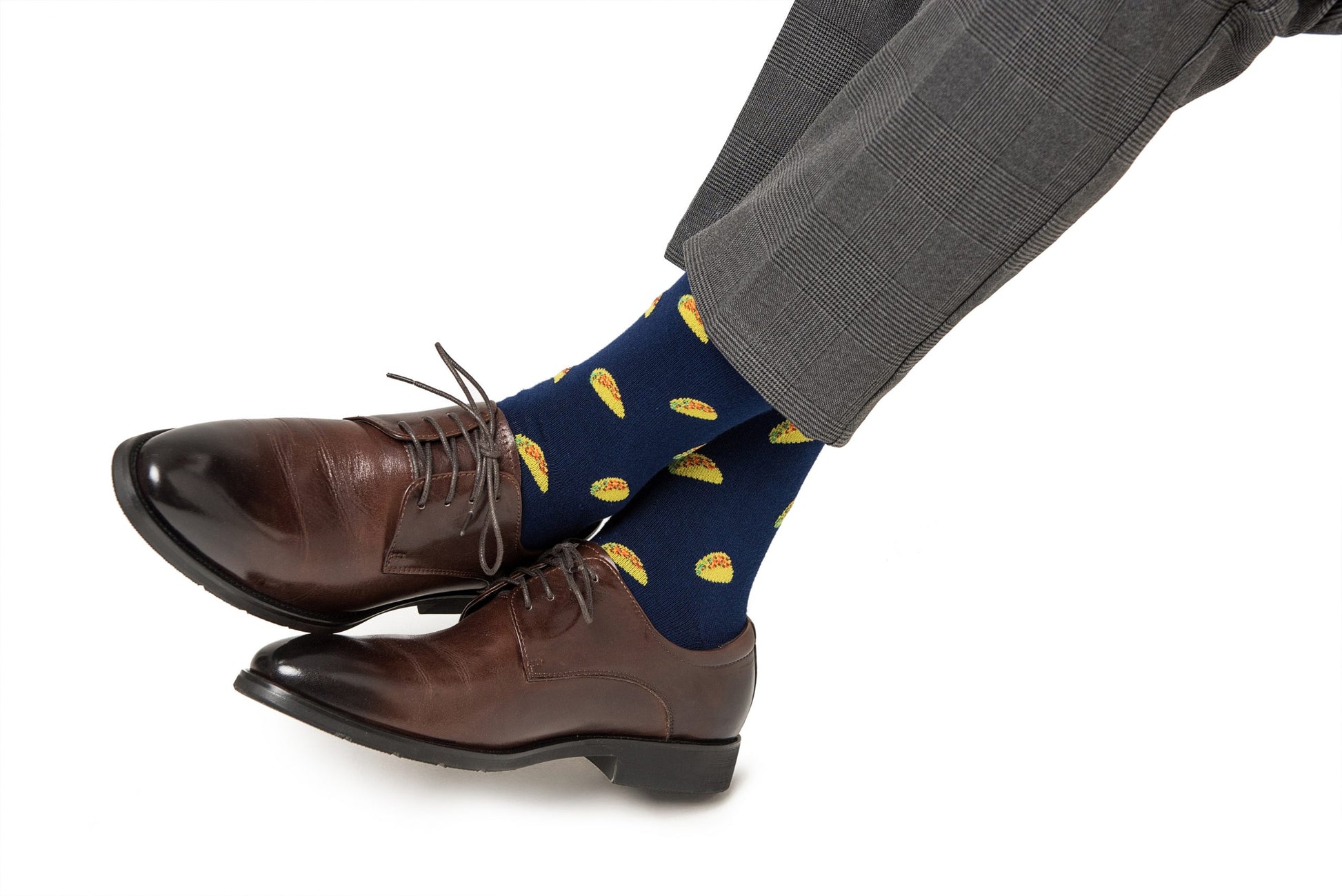 Brown dress shoes with grey trousers and Taco Socks featuring lemon prints.