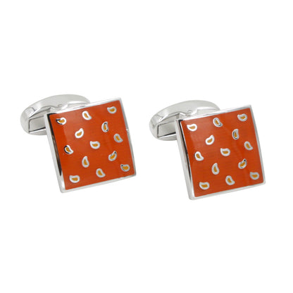 The Tear Drop Orange Cufflinks are a pair of silver square cufflinks with an orange face, adorned with small white droplet shapes, perfect for adding zest to your formal attire.