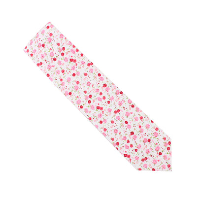 The Tonal Pink Azalea Floral Cotton Skinny Tie features a delicate floral pattern on a white background, highlighting soft pink hues.