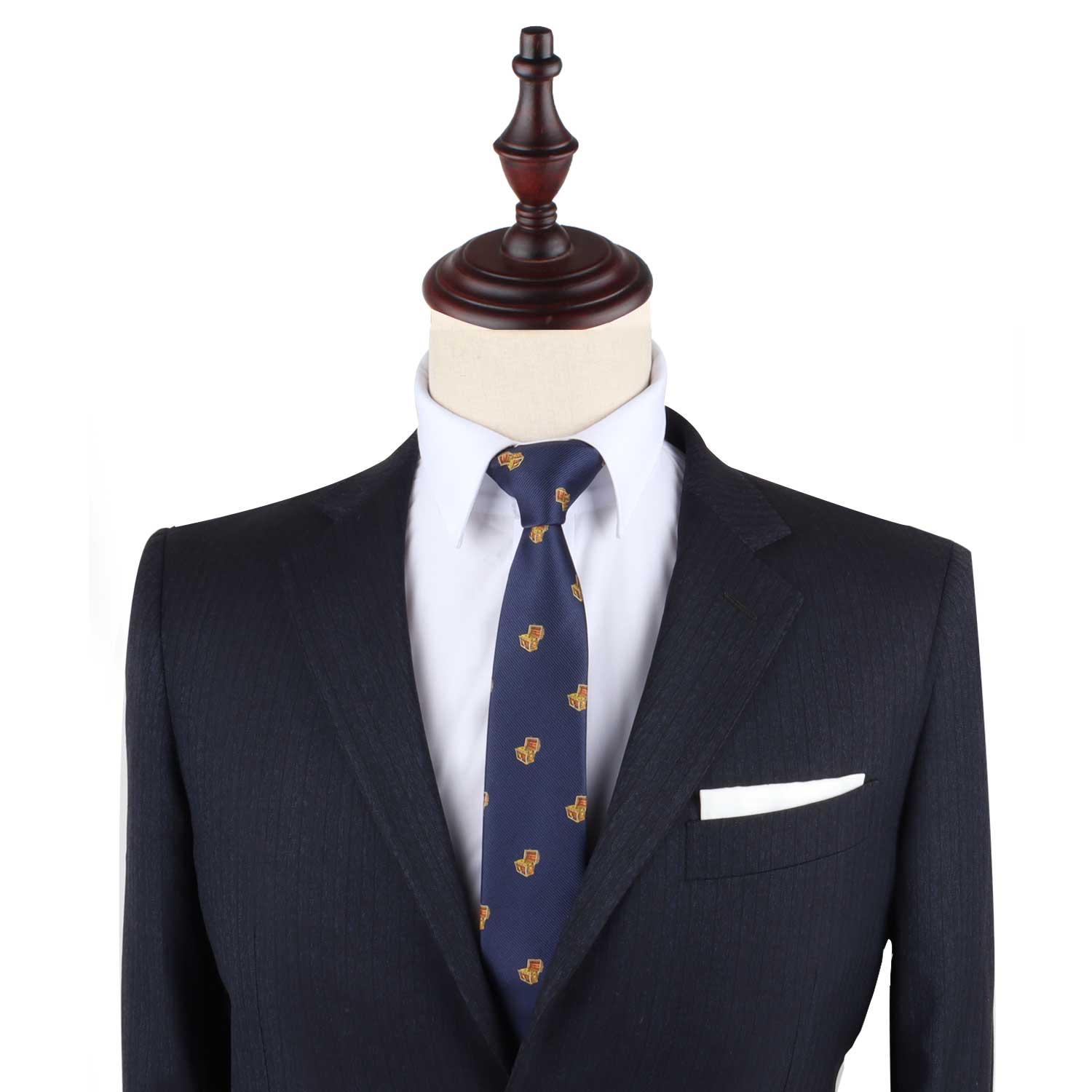 Navy blue suit with Treasure Chest Slim Tie and white pocket square displayed on a headless mannequin, designed as attire for any uncover adventure.