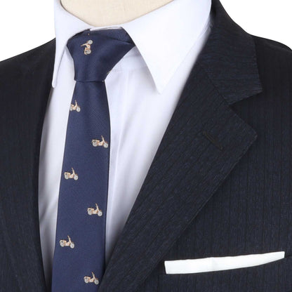 The mannequin is dressed in a dark pinstripe suit, white shirt, and the Vintage Motorcycle Tie, which is adorned with small motorcycle patterns and exudes an air of elegance that seamlessly combines the sophistication of fashion with the excitement of the fast lane.