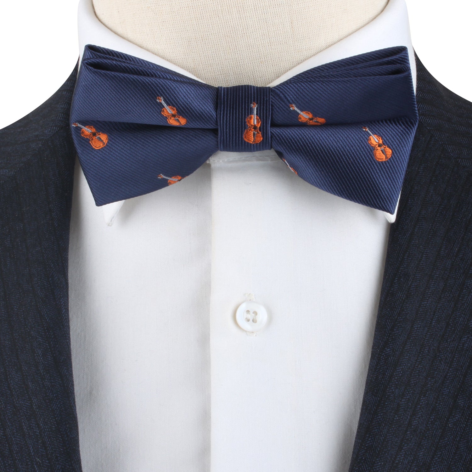 A Violin Bow Tie is worn with a white dress shirt and a dark suit jacket, adding a touch of sophistication.