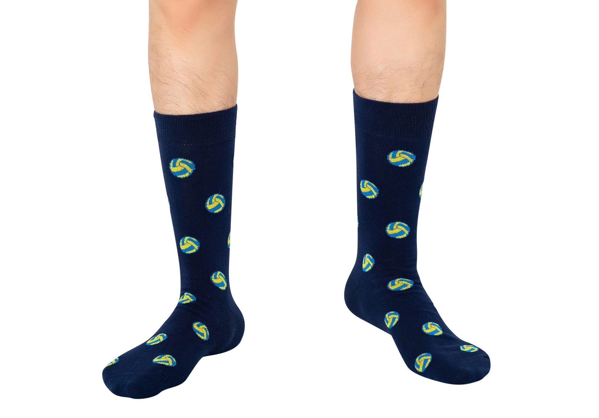 Sporting knee-high volleyball socks in navy blue with a lively volleyball pattern, this person is ready to elevate their sock game.