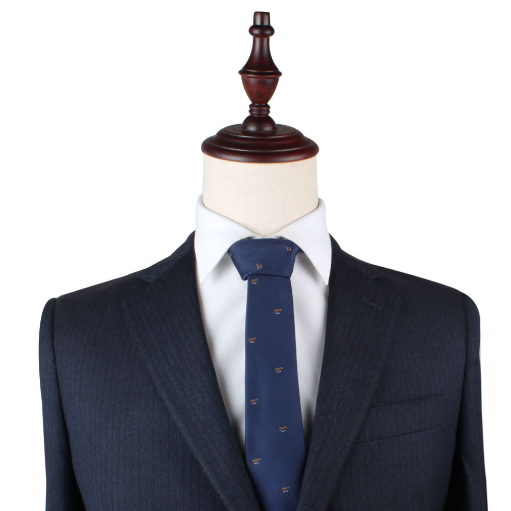 Mannequin dressed in a dark pinstriped suit jacket, white dress shirt, and an elegant Thoroughbred Horse Skinny Tie featuring small patterns, set against a plain white background.