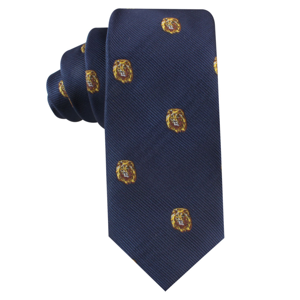 Introducing the King Lion Skinny Tie, a dark blue tie adorned with a pattern of small, gold embroidered lion heads that symbolize courage and leadership.