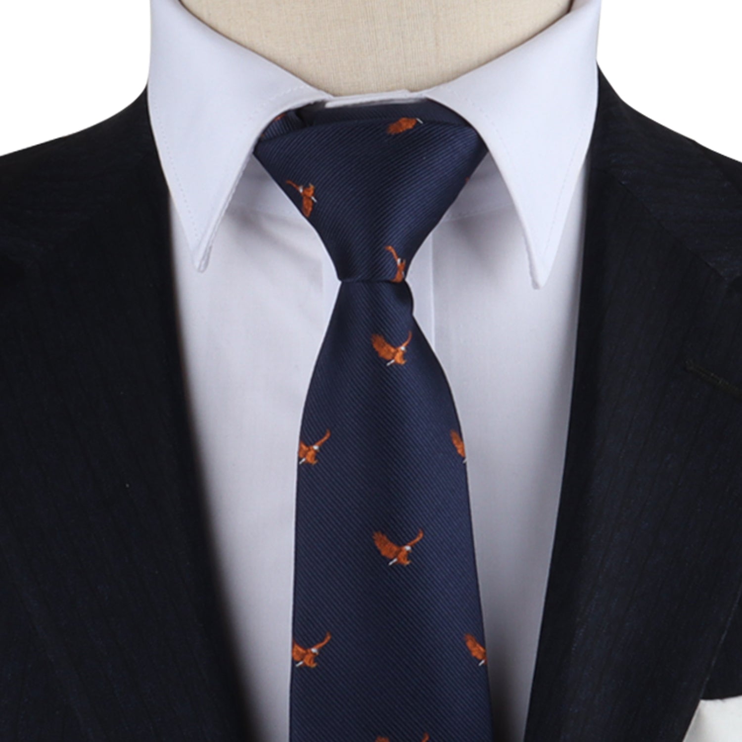 A person is embracing majestic fashion, wearing the Wildlife Print Tie a navy blue accessory adorned with small orange bird patterns that seem to soar. This tie perfectly complements a crisp white dress shirt and a dark suit jacket.