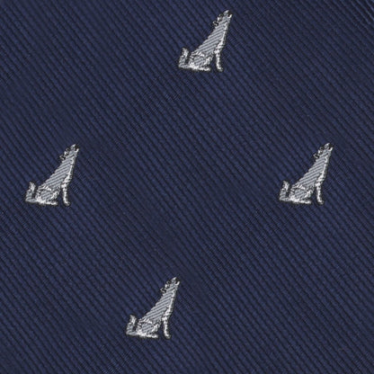 Uncover the Wolf Bow Tie, featuring dark blue fabric with diagonal lines and a repeated pattern of small light gray embroidered howling wolves, adding elegance to any formal look.