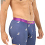 A man models navy "Wolf Underwear" boxer briefs with a purple waistband and a white wolf print, providing a breathable fit.