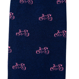 A close-up of the Pink Bike Socks showcasing the charming bright blue base with a playful pink bicycle pattern, ensuring ultimate comfort for every pedal.