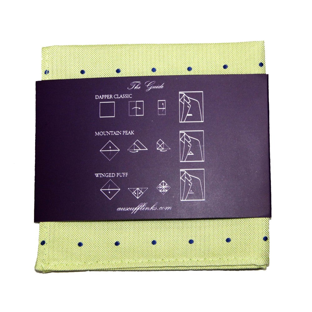 The Gold Navy Polka Dot Business Tie & Pocket Square Set includes a green polka-dot pocket square with a dark band and folding instructions for Dapper Classic, Mountain Peak, and Winged Puff styles, ideal for completing your sophisticated look.