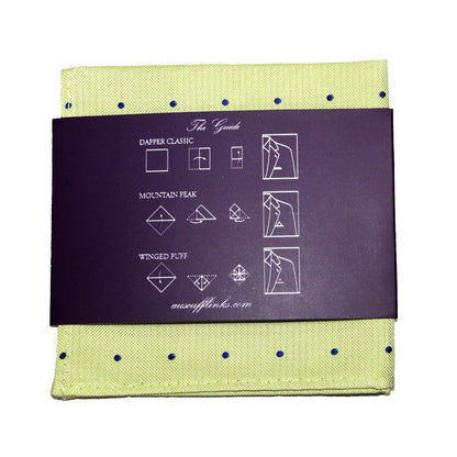 The Gold Navy Polka Dot Business Tie & Pocket Square Set includes a green polka-dot pocket square with a dark band and folding instructions for Dapper Classic, Mountain Peak, and Winged Puff styles, ideal for completing your sophisticated look.