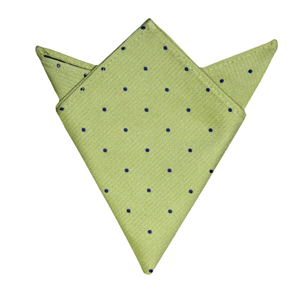 The Gold Navy Polka Dot Business Tie & Pocket Square Set includes a green pocket square with dark blue polka dots, intricately folded into a geometric triangle with two points, complemented by a gold navy polka dot tie for an elegant ensemble.